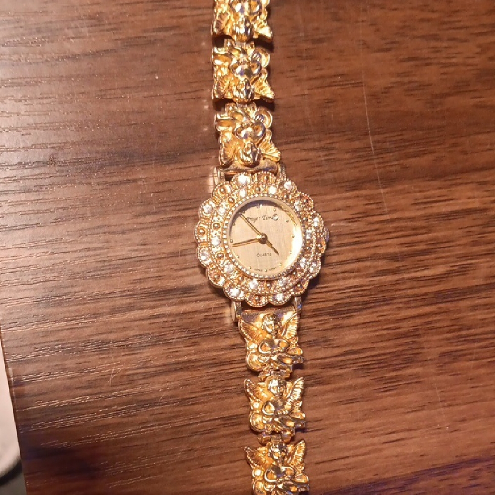 Gold Designer Watch with Intricate Detailing